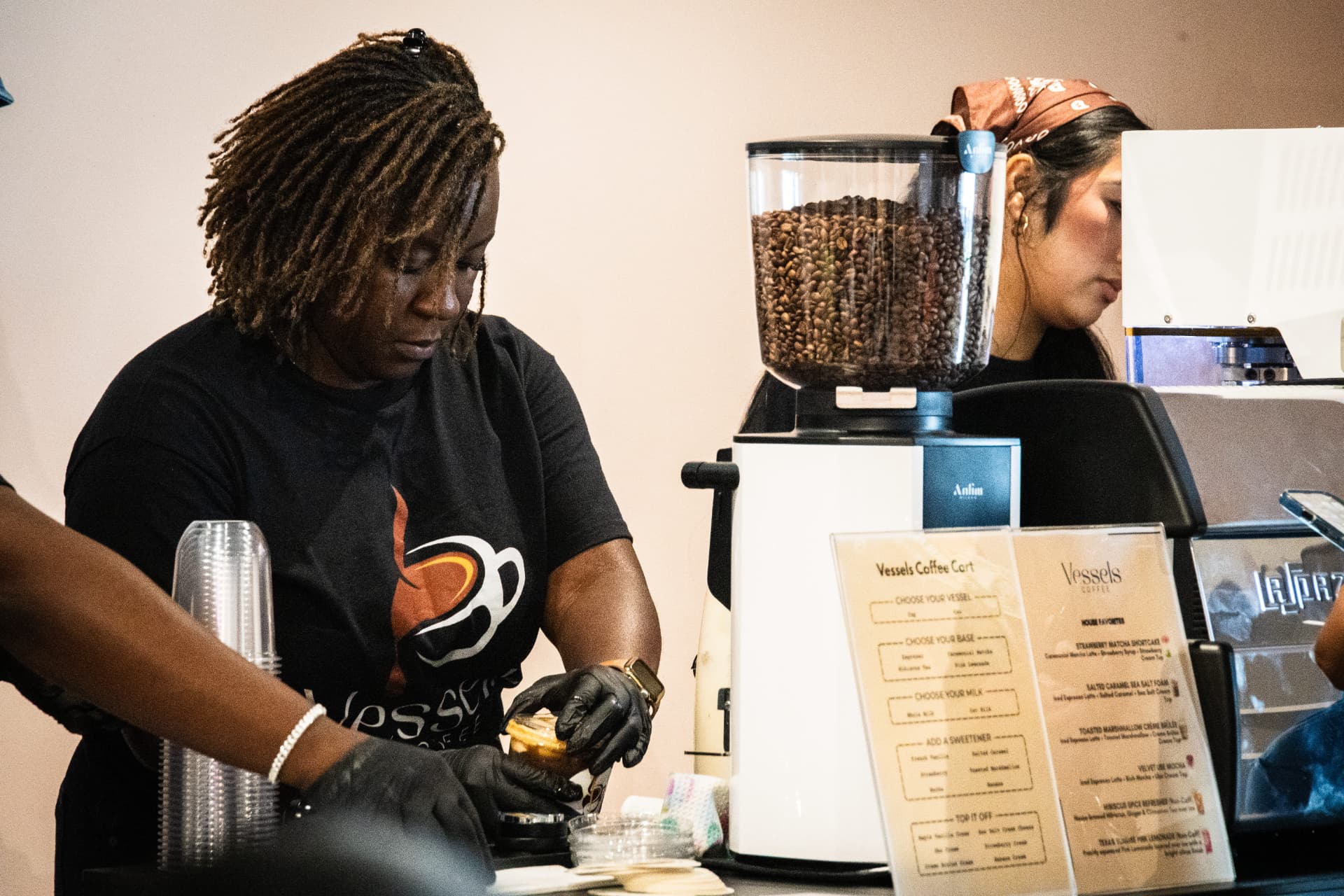 Vessels Coffee baristas serving drinks at an event