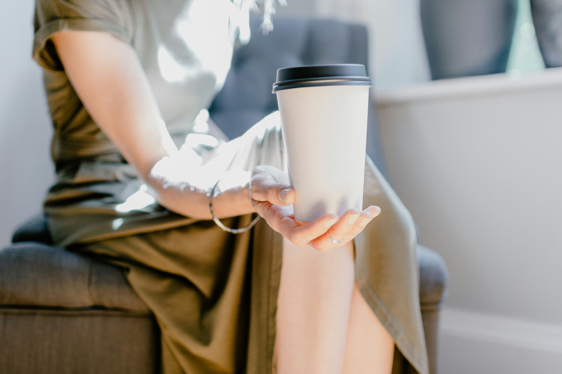 Hand holding a freshly prepared coffee cup at a Houston corporate event
