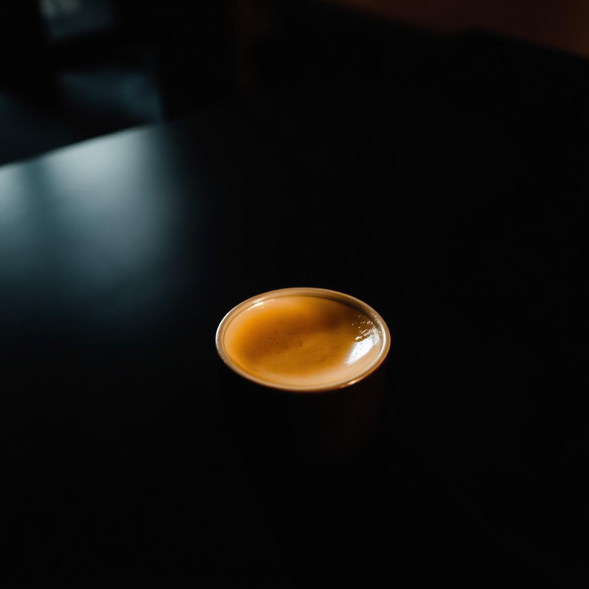 Cortado on a dark counter